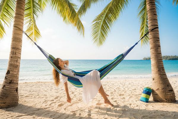 Outdoor Zen double cotton hammock hung between two trees in a garden
