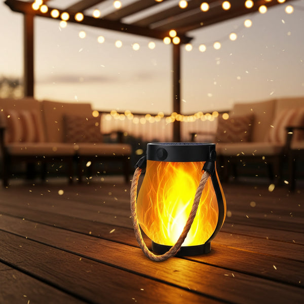 Ignis solar lantern with 3D flickering flame hanging in a garden at night